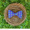 purple bow tie in basket